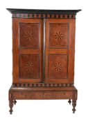 A Ceylonese hardwood and inlaid press cupboard