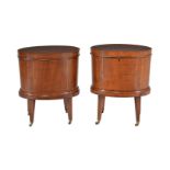 A matched pair of mahogany and tulipwood crossbanded oval cellarettes