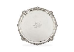 A large Edwardian silver shaped circular salver by Harrison Brothers & Howson