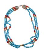 A turquoise and red bead necklace by Natalia Josca