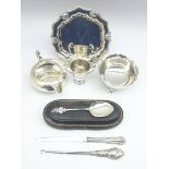 Silver circular card tray, small silver trophy, silver cream jug,