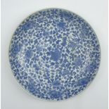 Chinese provincial circular shallow bowl with an all-over pattern of flowers and leaves in blue
