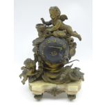 Small late 19th century clock, gilt putti and floral swag decoration surrounding globular dial,