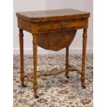 Victorian figured walnut and amboyna banded games table,