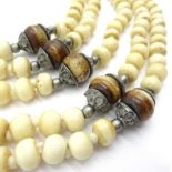 Early 20th century ivory bead necklace and bangle