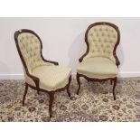 Pair Victorian walnut framed upholstered chairs, carved detail,