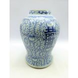 Large late 19th Century Chinese baluster vase with an all-over floral pattern in blue and white