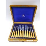 Set of 12 silver bladed dessert knives and forks with ivory handles in oak case London 1903,