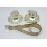 Silver patent note clip by Child and Child London 1903 and a pair of small silver capstan inkwells