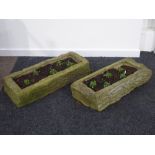 Two narrow rectangular stone troughs,