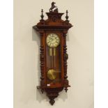 Late 19th century walnut cased Vienna wall clock, horse figure pediment with turned finials,