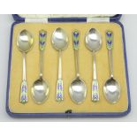 Set of six silver and enamel tea spoons with chevron finials, boxed,
