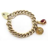 9ct gold curb link bracelet with carnelian claw charm and St.