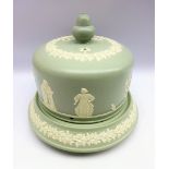 Late Victorian pottery cheese dome and stand decorated in relief with classical figures,