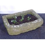 Rectangular weather stone trough with canted corner, planted,