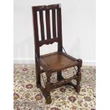 18th century elm country chair, carved top rail, moulded uprights and seat rails, panelled seat,