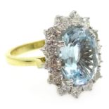 White gold oval aquamarine and diamond cluster ring, aquamarine 3.3 carat, diamonds approx 1.