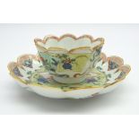 Chinese Kangxi famille verte tea bowl and saucer with crimped rim and painted with vases and