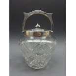 Cut glass biscuit barrel with silver collar,