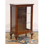 Small early 20th century walnut display cabinet, single glazed door enclosing glass shelves, W49cm,
