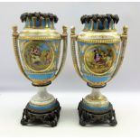 Pair late 19th century Sevres style two handled urn shaped vases with Ormolu mounts and painted