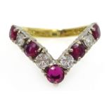 Gold ruby and diamond wishbone ring,