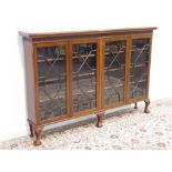 20th century Georgian style mahogany bookcase, rectangular top above blind fret work frieze,