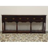 17th century style medium oak dresser base, rectangular top above three drawers,