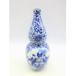 19th Century Chinese vase of baluster and flask design decorated in blue and white with panels of