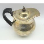 George III silver baluster water jug with hinged cover, blackwood handle and lift,