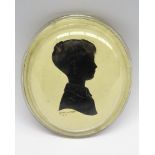 Oval silhouette of a child signed 10 x 8cms Lewis Wessex 1951