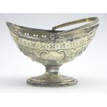 Navette shape sugar basket engraved with a crest and with later embossed decoration with swing