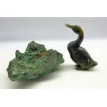 Malachite crystal specimen and a carved green hard stone model of a duck,