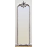 Silver finish ornate carved wood full length mirror, scrolled cartouche pediment,