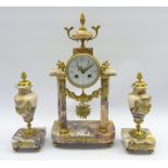 Early 20th century gilt metal and pink marble portico clock garniture,