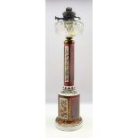 Late 19th century Bohemian overlaid ruby glass table oil lamp decorated with panels of flowers,