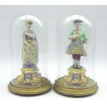 Pair of Continental bisque porcelain male and female standing figures in formal dress,