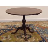 19th century mahogany tripod table, circular tilt top, turned vase shaped column,