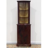 Reproduction figured mahogany bow front floor standing corner cabinet by M. J.