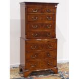Quality reproduction mahogany serpentine chest on chest, fitted with two short,