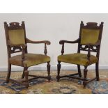 Pair early 20th century oak armchairs, carved with scrolled foliage,