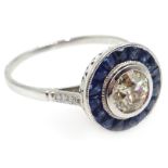 Art Deco style sapphire and diamond circular 18ct white gold (tested) ring, central diamond 0.