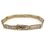 15ct white and yellow gold (tested) six bar gate bracelet, approx 10.