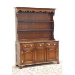 Georgian style oak dresser, raised two tier plate rack, rectangular moulded mahogany banded top,