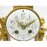 Early 20th century gilt metal and pink marble portico clock garniture,