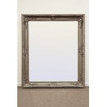 Large rectangular bevelled edge wall mirror in ornate swept silvered frame with shell and leaf