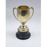 Plain silver s handled trophy on a plastic socle Birmingham 1925 H 26cms overall 11.