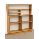 Craftsman made oak wall unit, raised combination shelving above two more shelves, W122cm, H134cm,