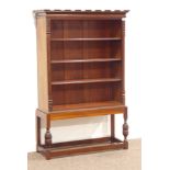 Victorian mahogany bookcase on later stand, three adjustable shelves, carved baluster supports,