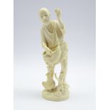 Japanese Meiji Period carved ivory Okimono of a man collecting eggs, signed to base, H19.
